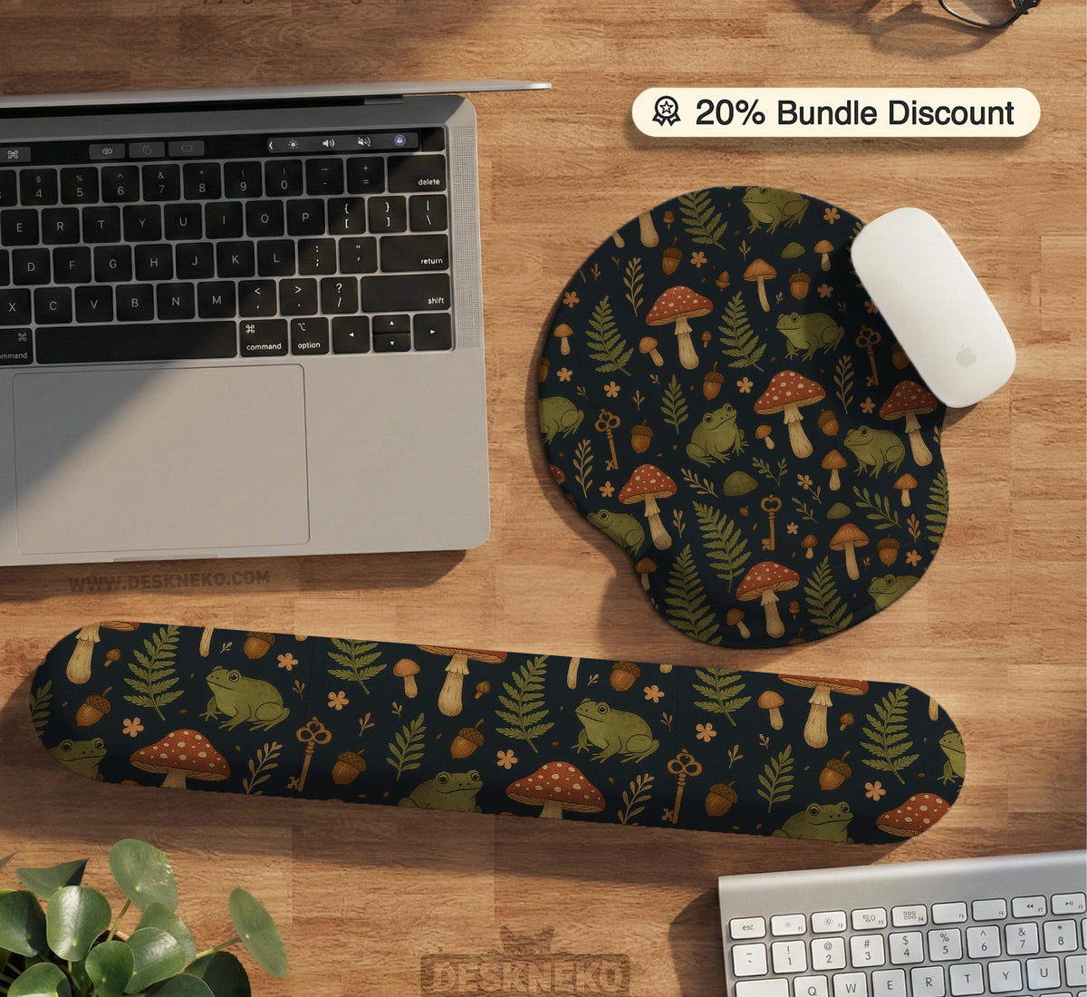 Dark botanical desk mat options with frogs, mushrooms, ferns, and acorns in brown and green tones, plus a matching keyboard wrist rest.