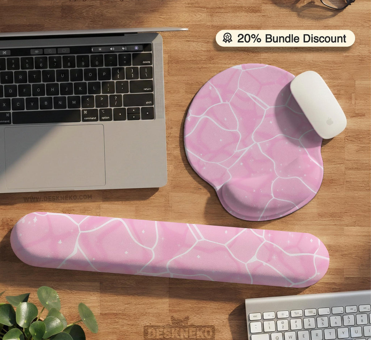 Soft pink mouse pad and wrist rest with a cloud-marble pattern, pale linework, and small star details.