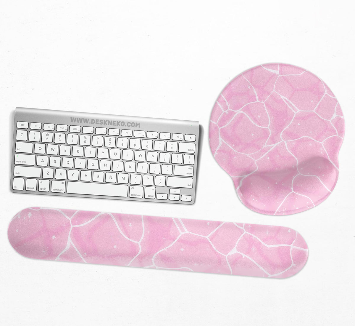 Soft pink mouse pad and wrist rest with a cloud-marble pattern, pale linework, and small star details.