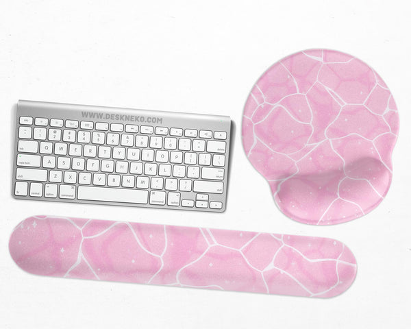 Soft pink mouse pad and wrist rest with a cloud-marble pattern, pale linework, and small star details.