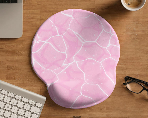 Soft pink mouse pad and wrist rest with a cloud-marble pattern, pale linework, and small star details.