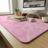 Soft pink desk mat with a kawaii cloud-marble pattern, white crackle lines, and small star accents.