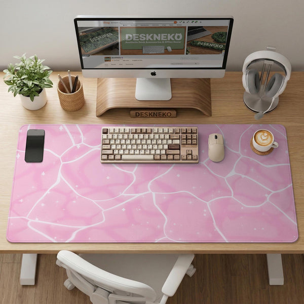 Soft pink desk mat with a kawaii cloud-marble pattern, white crackle lines, and small star accents.