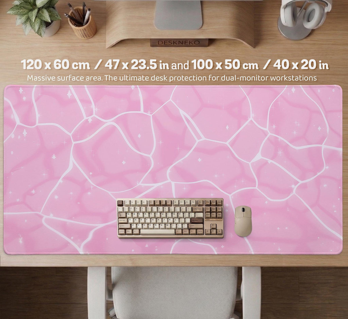 Pastel pink desk mat with a marble-style design, white flowing lines, and small sparkle accents.