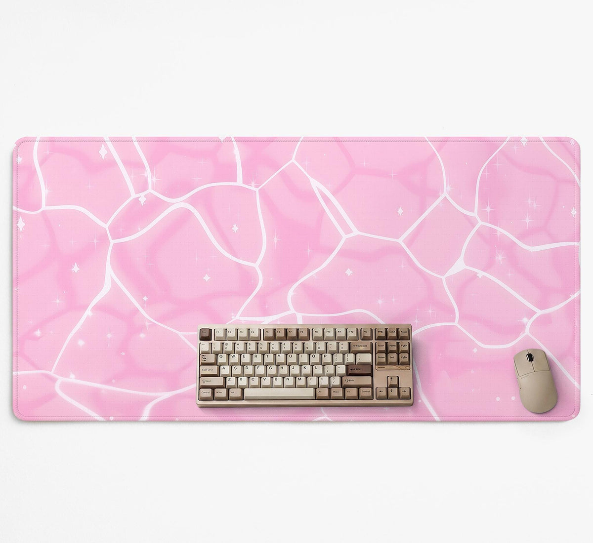 Soft pink desk mat with a kawaii cloud-marble pattern, white crackle lines, and small star accents.