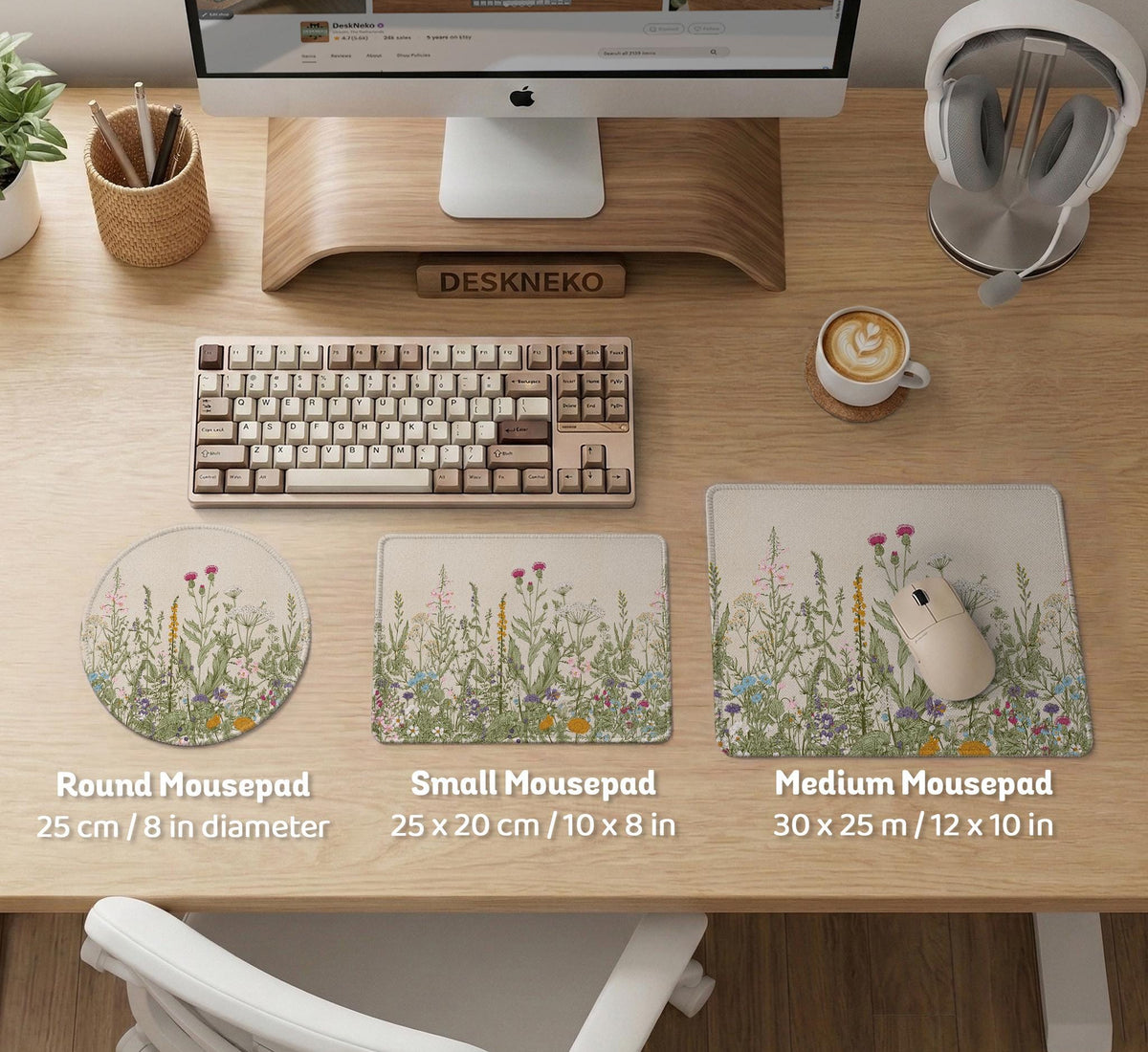 A desk mat with a botanical meadow design featuring wildflowers, leafy stems, and soft neutral colors.