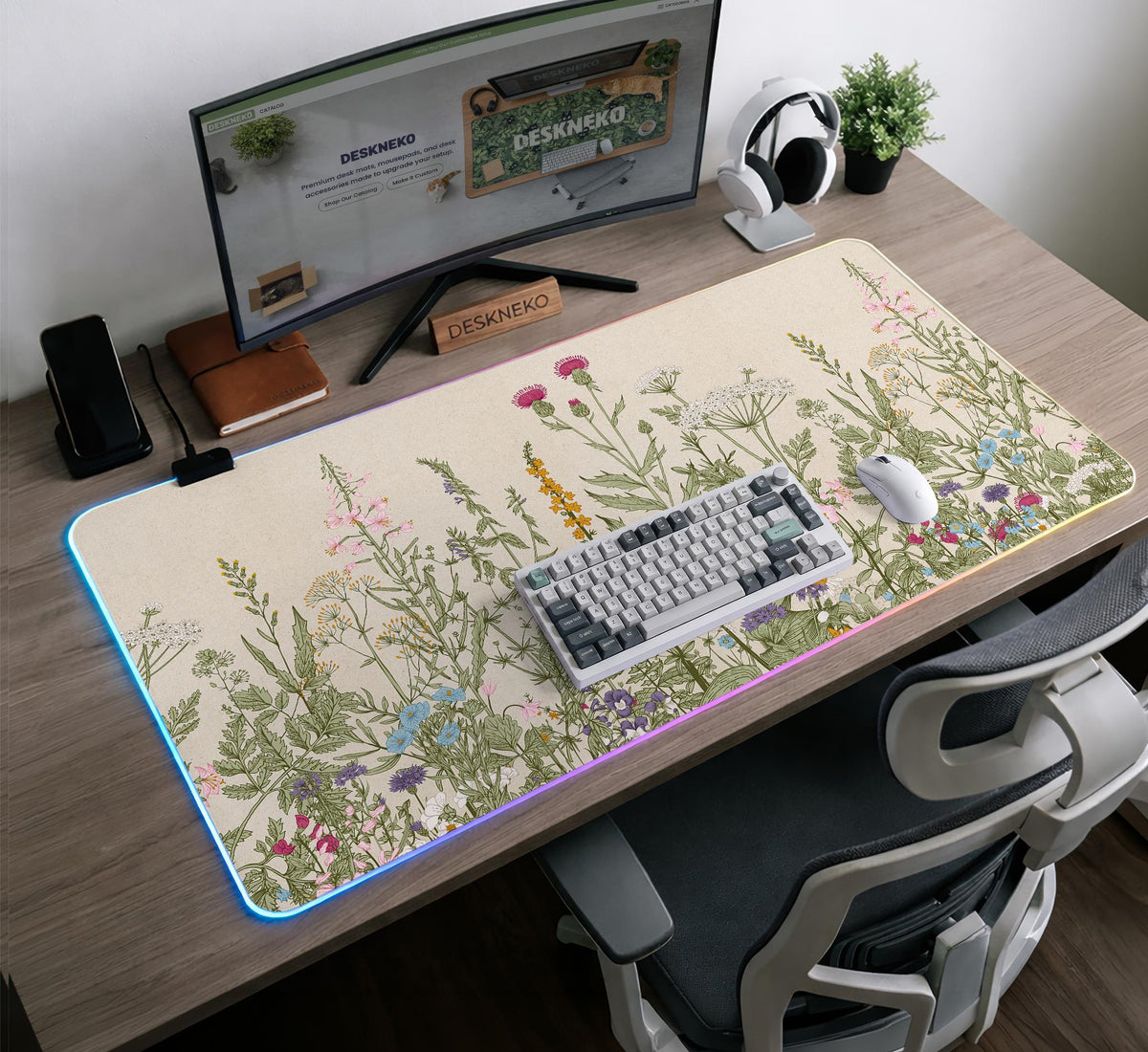 A desk mat with a botanical meadow design featuring wildflowers, leafy stems, and soft neutral colors.