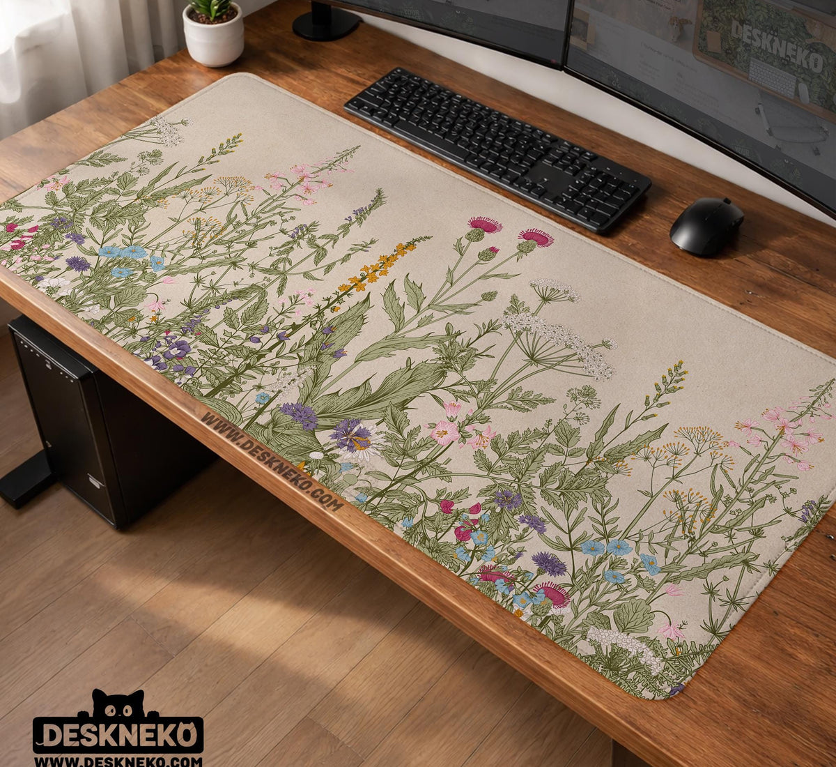 A desk mat with a botanical meadow design featuring wildflowers, leafy stems, and soft neutral colors.