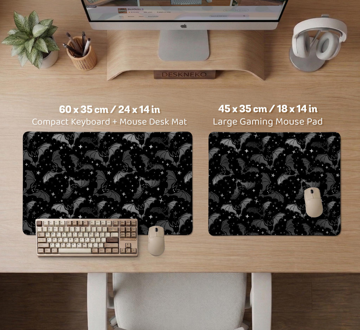 Black desk mat with a dark bat pattern and scattered stars on a charcoal background.