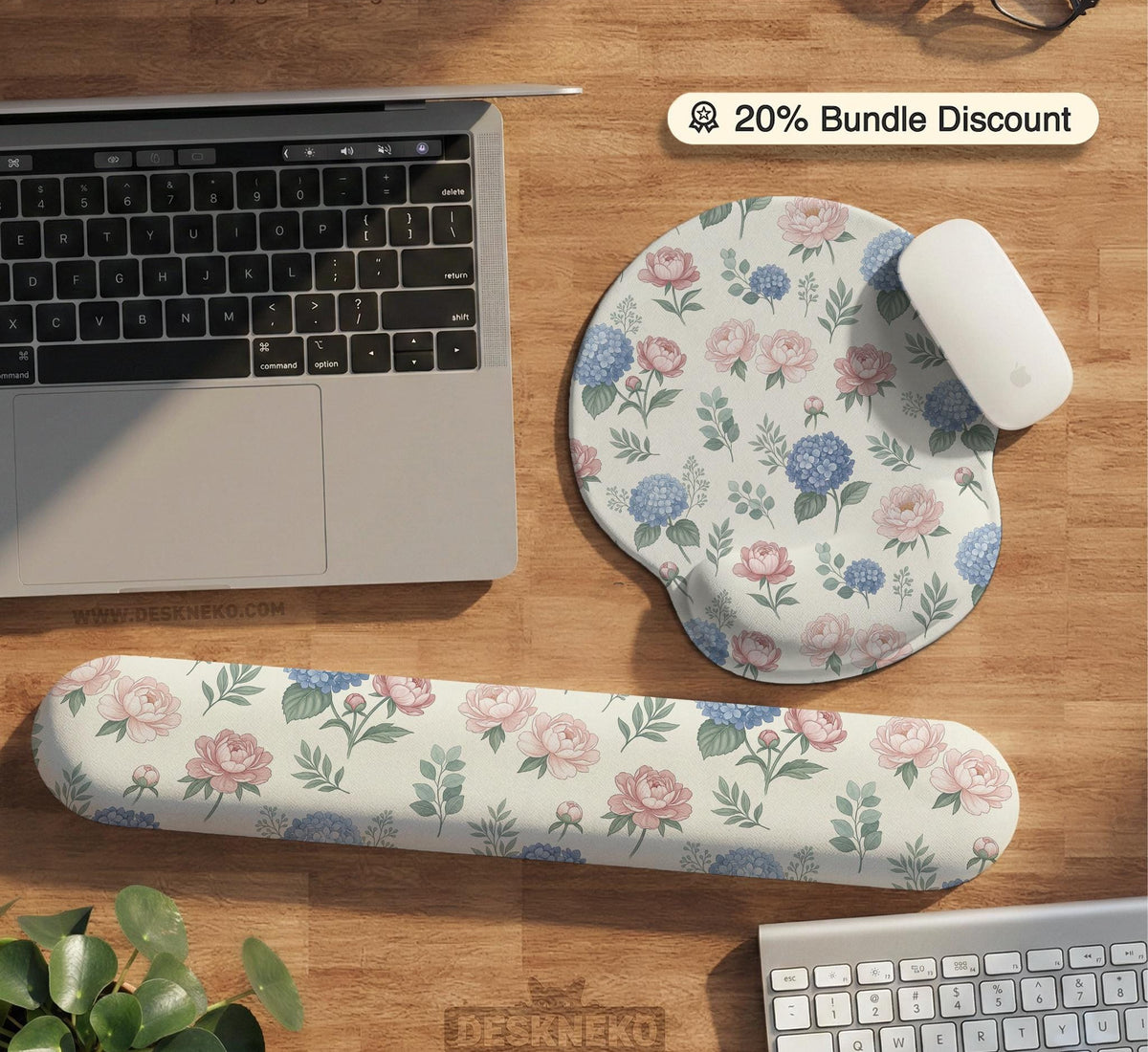 Floral desk mat with sage greenery, pink peonies, blue flowers, and a warm cream background.