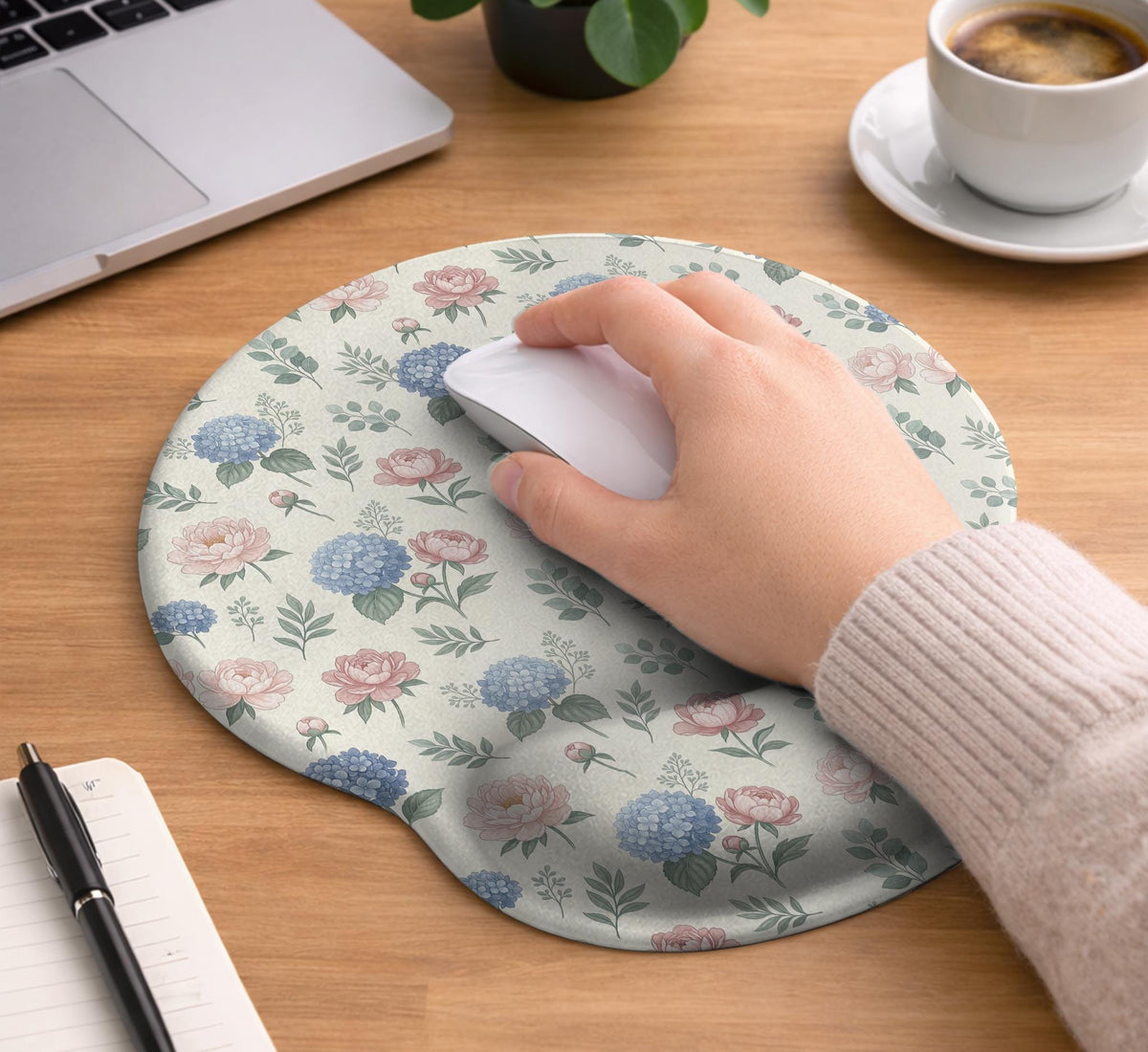 Mousepad and keyboard wrist rest with a floral print of blue hydrangeas, pink peonies, sage leaves, and a cream background.