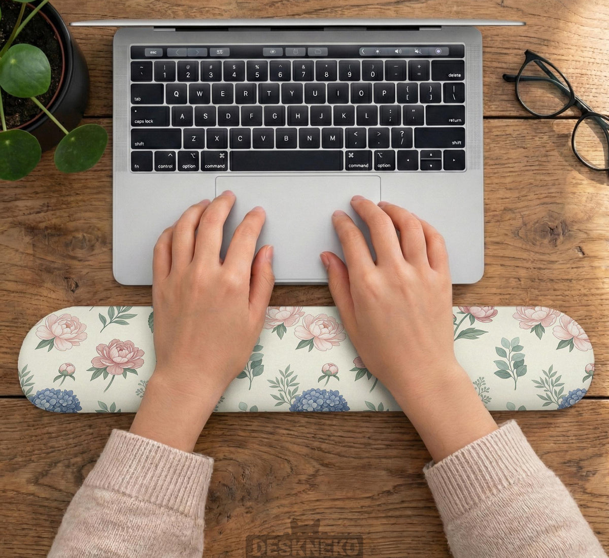 Mousepad and keyboard wrist rest with a floral print of blue hydrangeas, pink peonies, sage leaves, and a cream background.