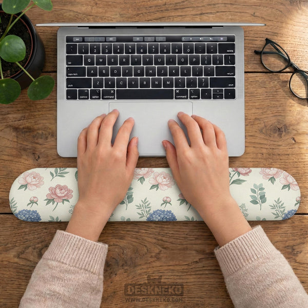 Mousepad and keyboard wrist rest with a floral print of blue hydrangeas, pink peonies, sage leaves, and a cream background.