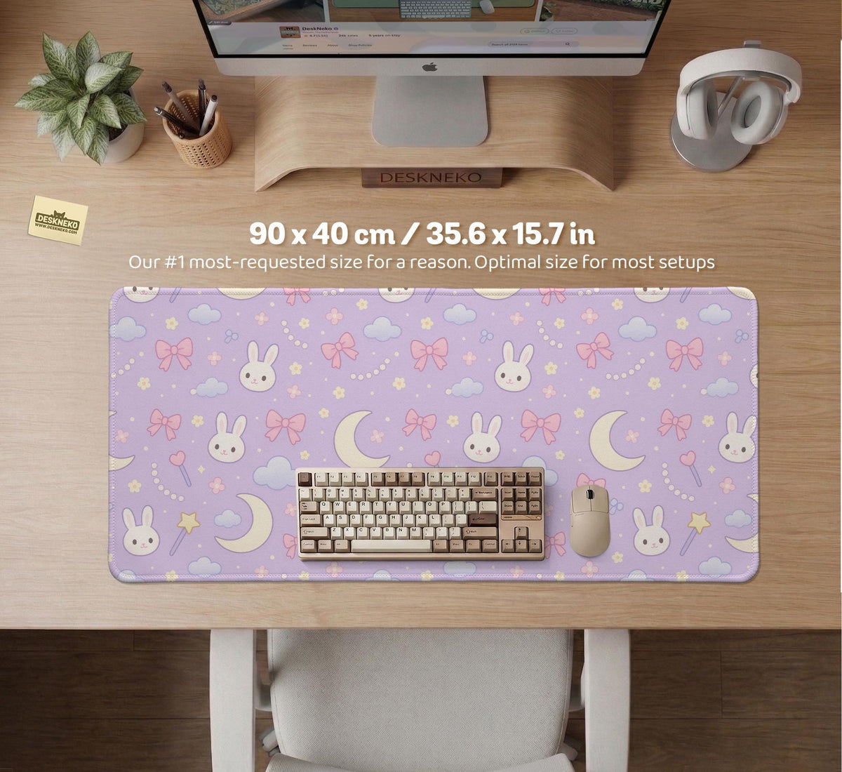 Pastel lavender desk mat with an all-over pattern of bunnies, crescent moons, clouds, bows, stars, and small flowers.