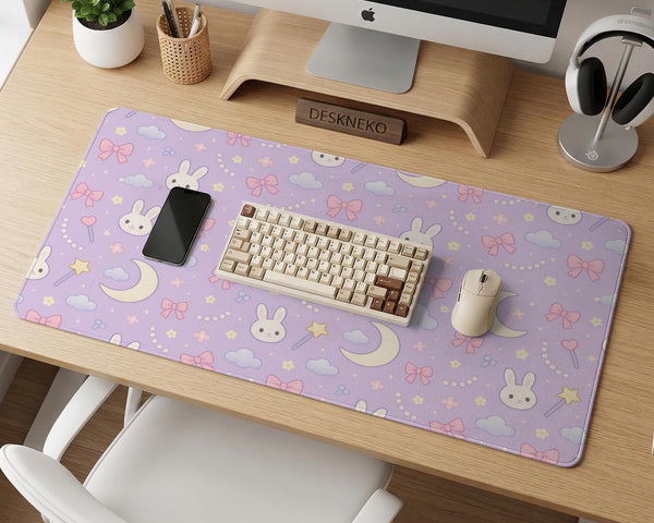 Pastel lavender desk mat with an all-over pattern of bunnies, crescent moons, clouds, bows, stars, and small flowers.