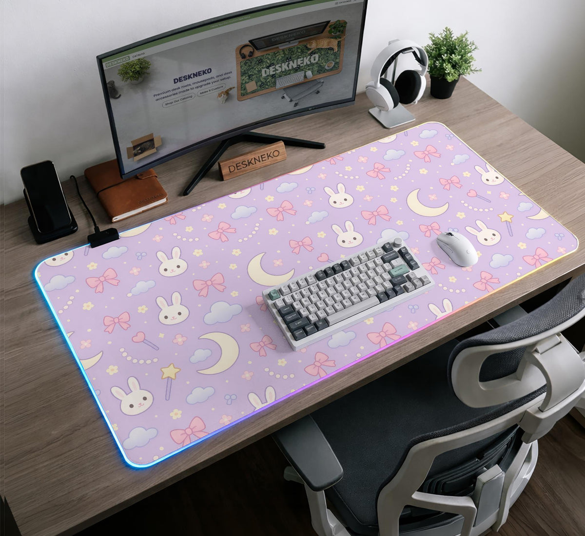 Pastel lavender desk mat with an all-over pattern of bunnies, crescent moons, clouds, bows, stars, and small flowers.