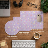 Pastel lavender desk mat with an all-over pattern of bunnies, crescent moons, clouds, bows, stars, and small flowers.