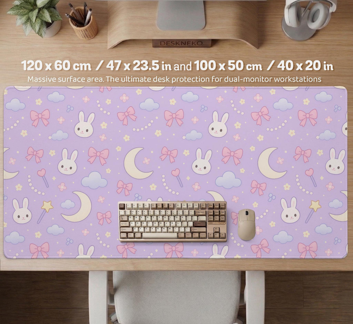 Lavender desk mat with an all-over pattern of bunny faces, clouds, moons, bows, and flowers in pastel colors.