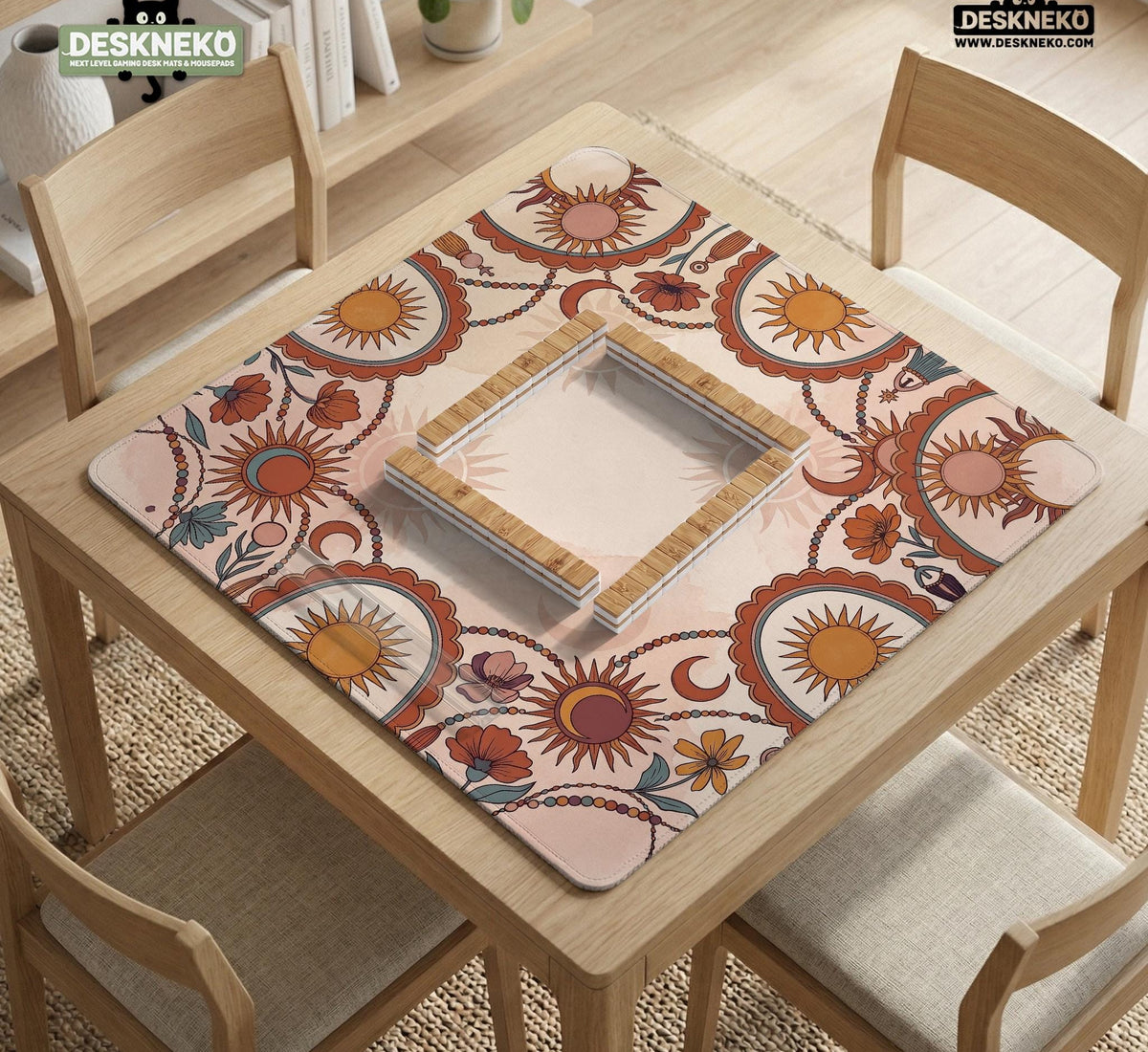 A square mahjong mat with a scalloped edge, sun and moon artwork, terracotta flowers, a soft cream background, and a decorative border around the play area.