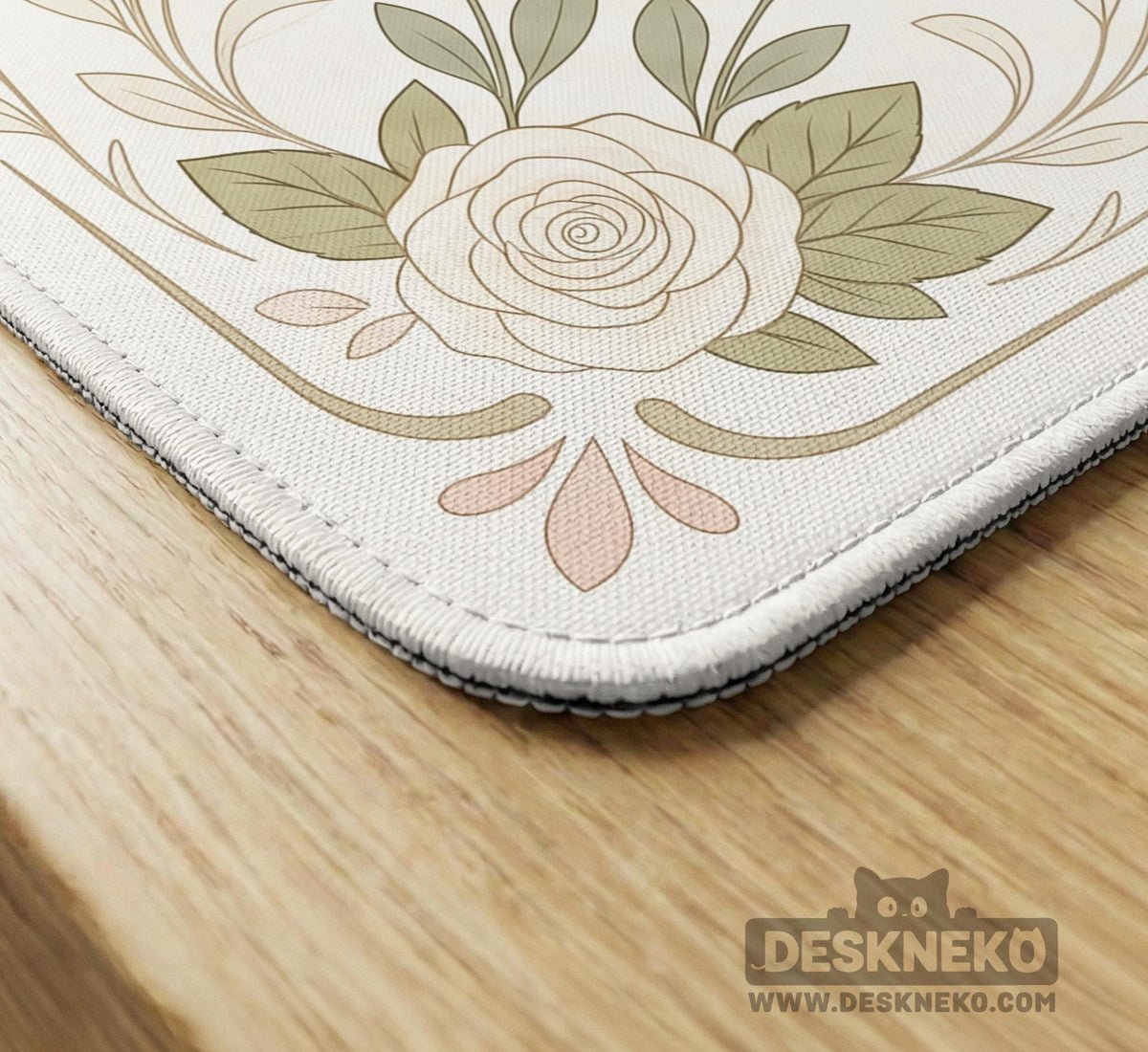 Square mahjong mat with a light floral border in sage green, cream, and blush around a plain center play area.
