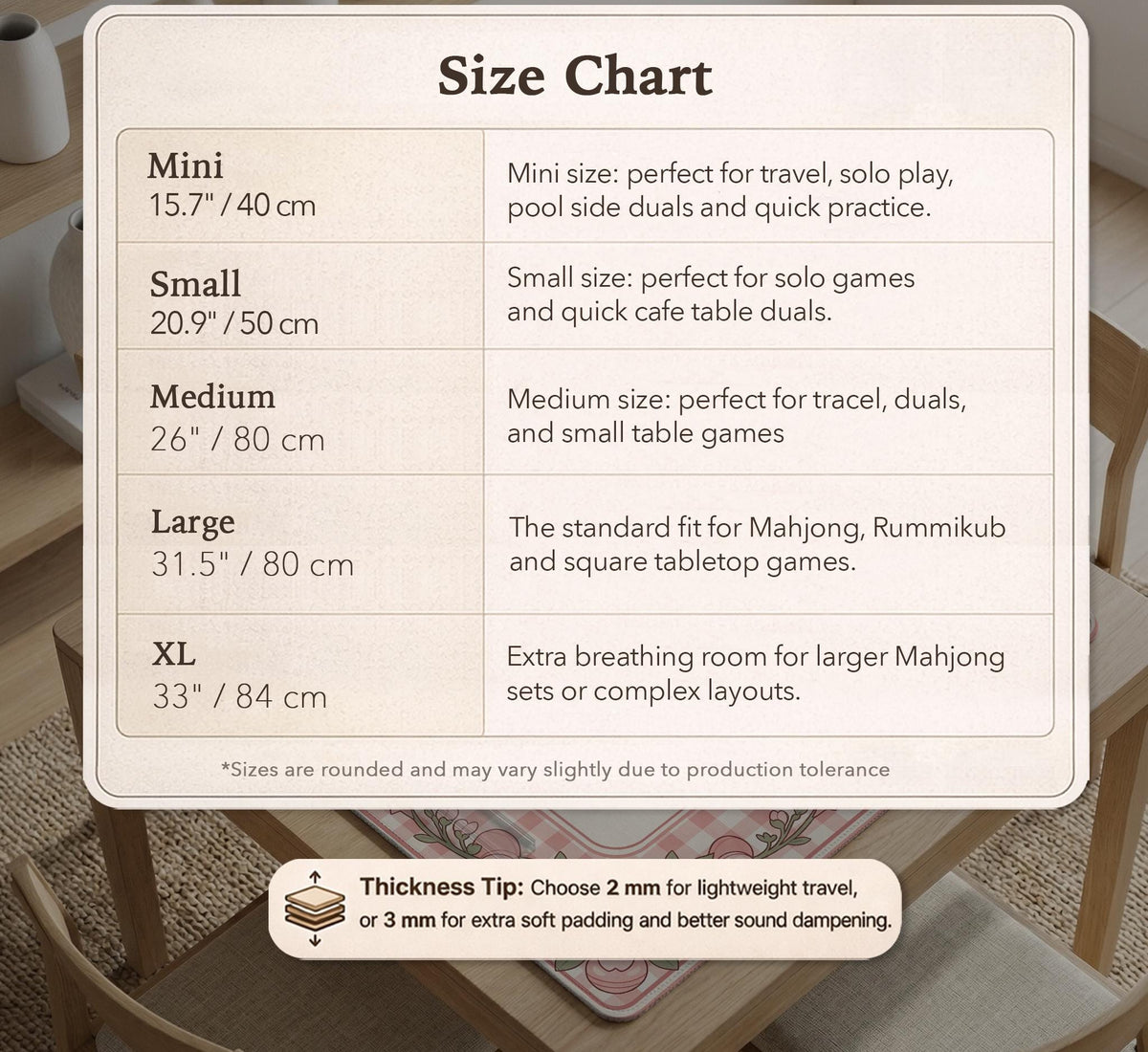 Pink gingham mahjong mat with a floral border, cherry blossom details, and a bow design around a plain center play area.
