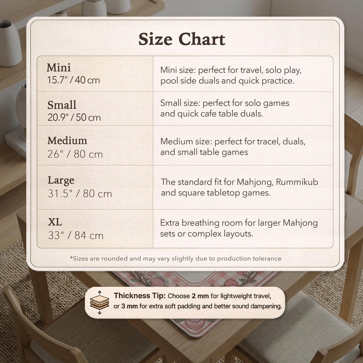 Square pink mahjong mat with a gingham border, floral corner details, and ribbon accents on a light background.