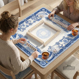 Blue and white square mahjong mat with a koi fish and lotus border design and a plain center area.