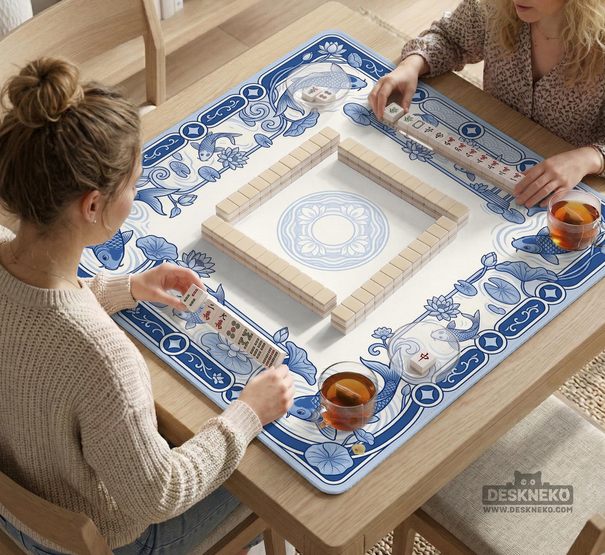Navy blue square mahjong table mat with lotus flowers and koi fish in a porcelain-style border and a plain center.