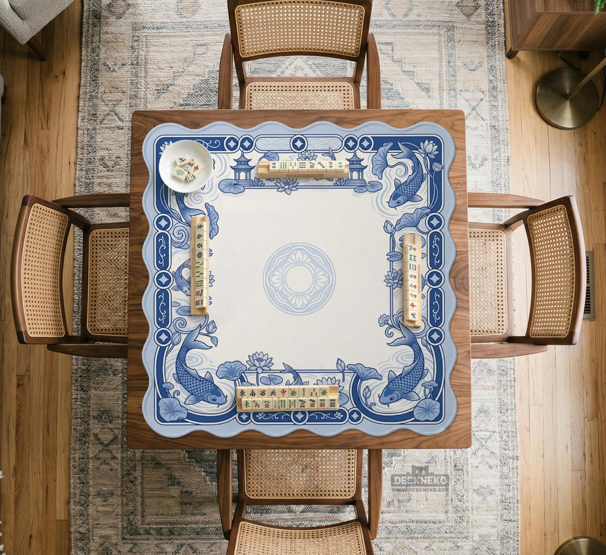 Navy blue square mahjong table mat with lotus flowers and koi fish in a porcelain-style border and a plain center.