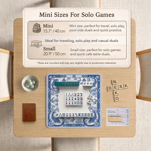 Blue and white square mahjong mat with a koi fish and lotus border design and a plain center area.