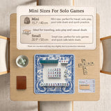 Navy blue square mahjong table mat with lotus flowers and koi fish in a porcelain-style border and a plain center.