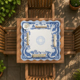 Navy blue square mahjong table mat with lotus flowers and koi fish in a porcelain-style border and a plain center.