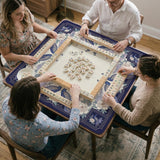 Blue mahjong mat with a floral peacock border and an open center area for tile play.