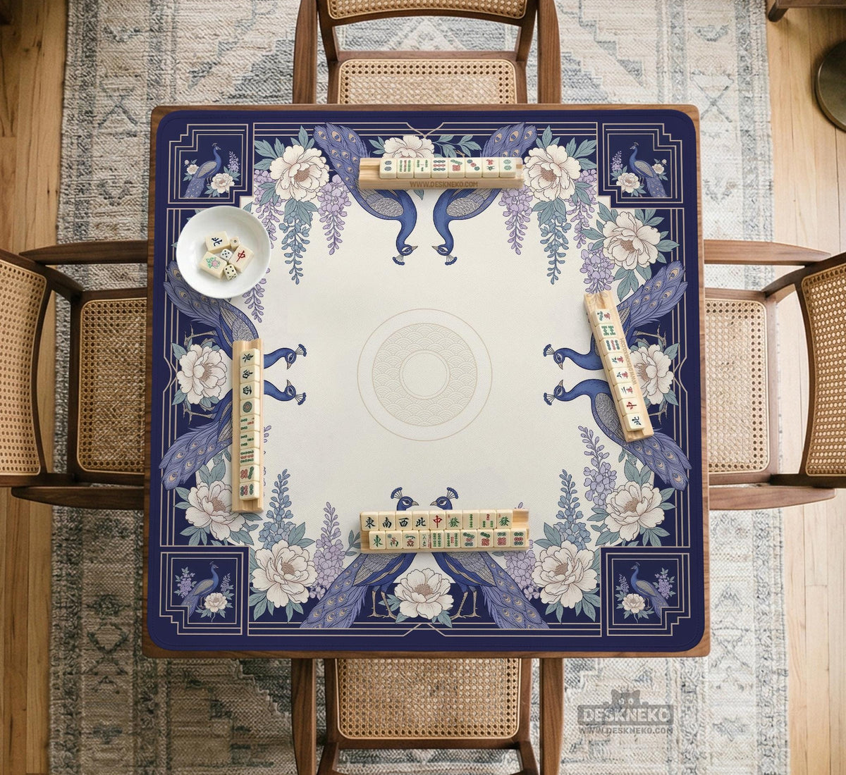 Blue mahjong mat with a floral peacock border and an open center area for tile play.