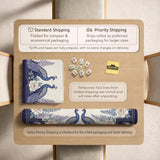 Blue mahjong table mat with a peacock and floral border, ivory center, lavender flowers, and scalloped edges.