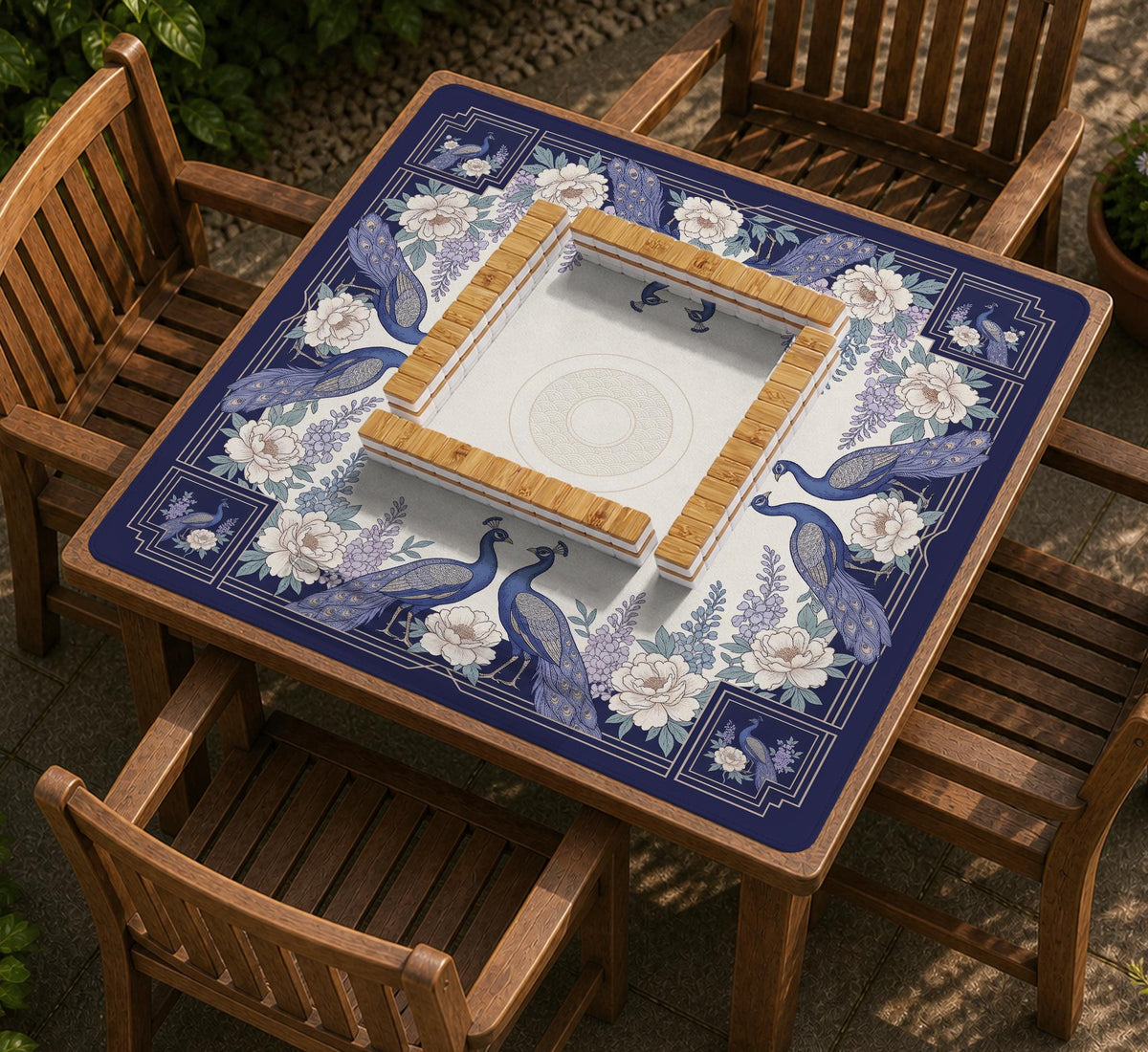 Blue mahjong mat with a floral peacock border and an open center area for tile play.