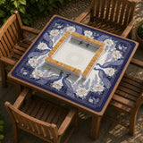 Blue mahjong mat with a floral peacock border and an open center area for tile play.