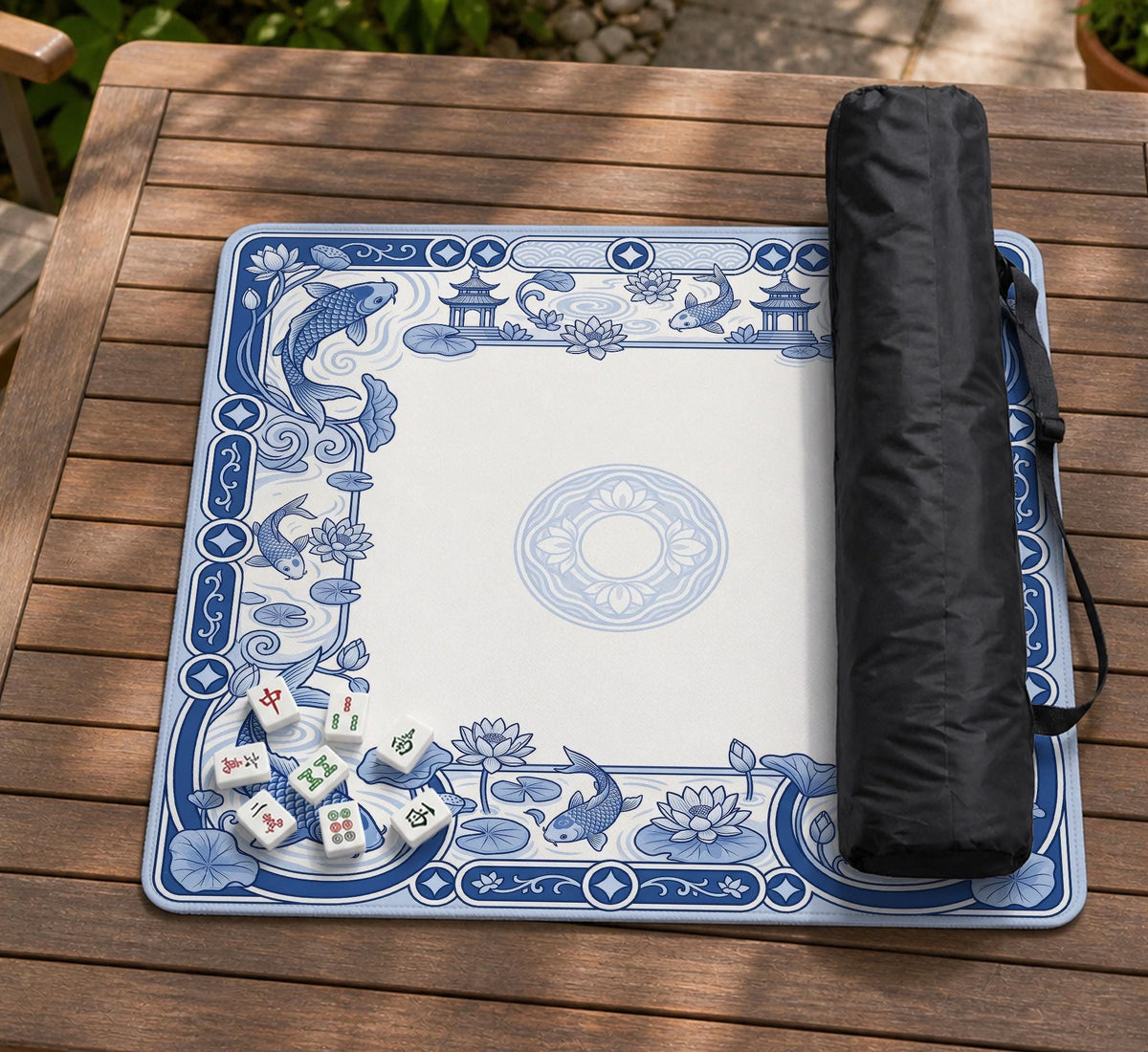 Blue and white square mahjong mat with a koi fish and lotus border design and a plain center area.