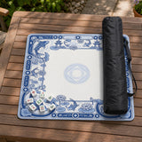 Navy blue square mahjong table mat with lotus flowers and koi fish in a porcelain-style border and a plain center.