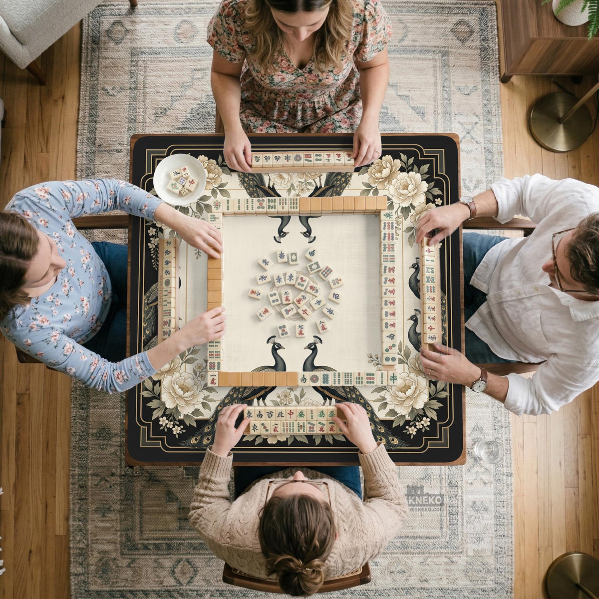 Square ivory mahjong mat with a black peacock border, cream flowers, and gold accent details.