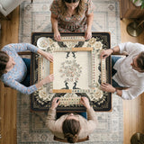 Square ivory mahjong mat with a black peacock border, cream flowers, and gold accent details.