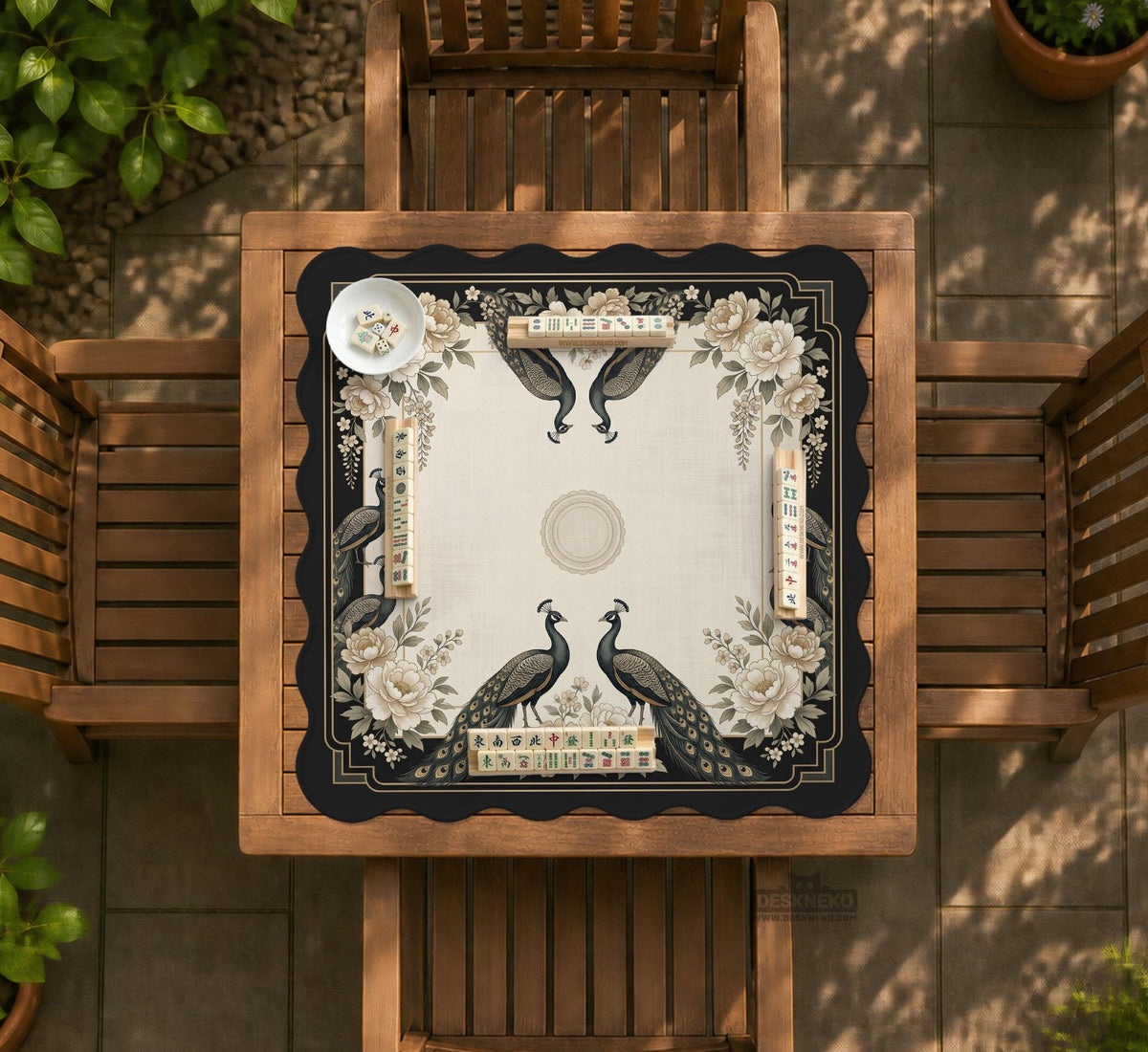Square ivory mahjong mat with a black peacock border, cream flowers, and gold accent details.
