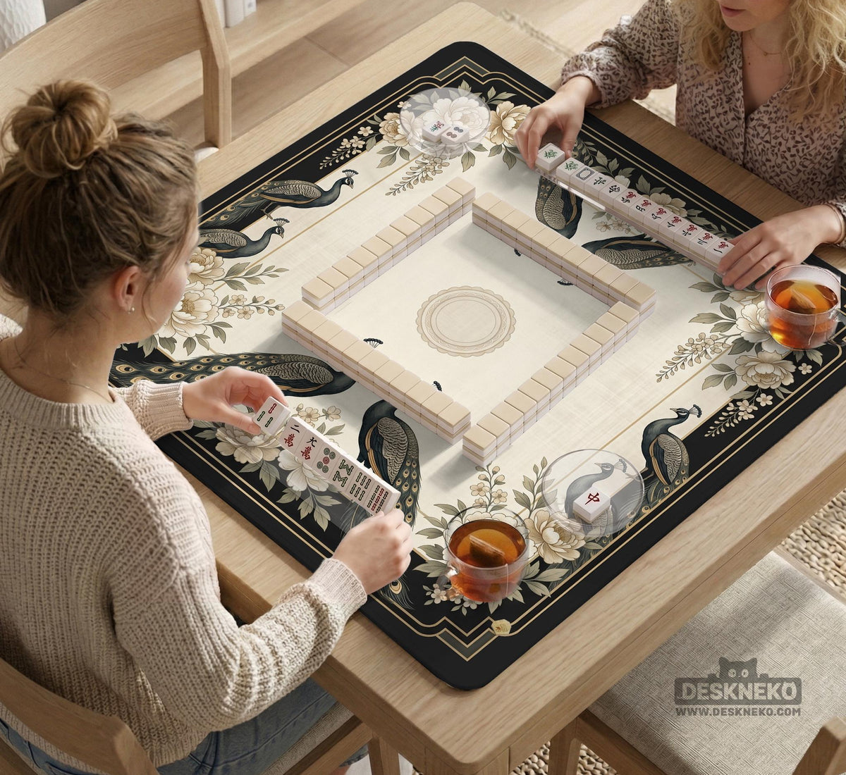 Cream mahjong table mat with a chinoiserie floral border, dark peacocks, soft gold linework, and an open center area.