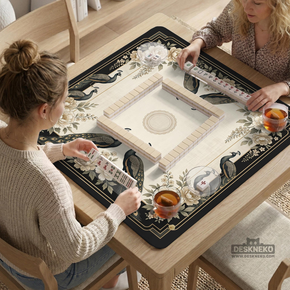 Cream mahjong table mat with a chinoiserie floral border, dark peacocks, soft gold linework, and an open center area.