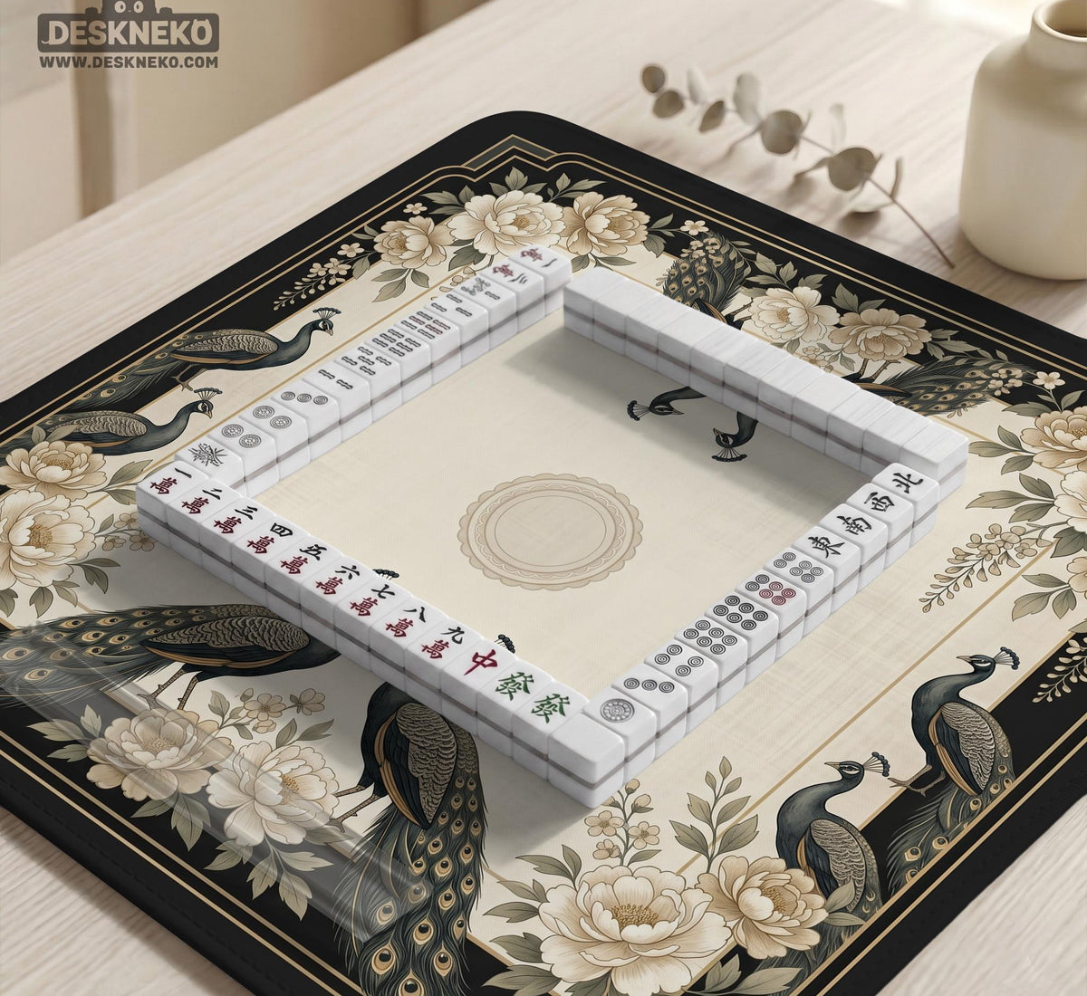 Cream mahjong table mat with a chinoiserie floral border, dark peacocks, soft gold linework, and an open center area.