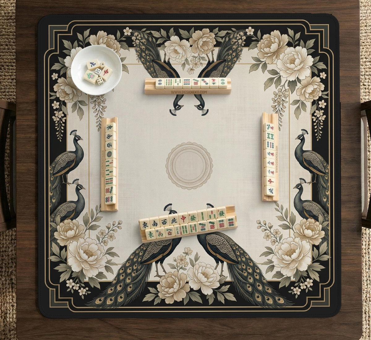 Square ivory mahjong mat with a black peacock border, cream flowers, and gold accent details.