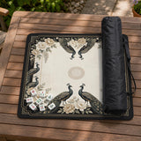 Square ivory mahjong mat with a black peacock border, cream flowers, and gold accent details.