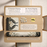 Cream mahjong table mat with a chinoiserie floral border, dark peacocks, soft gold linework, and an open center area.
