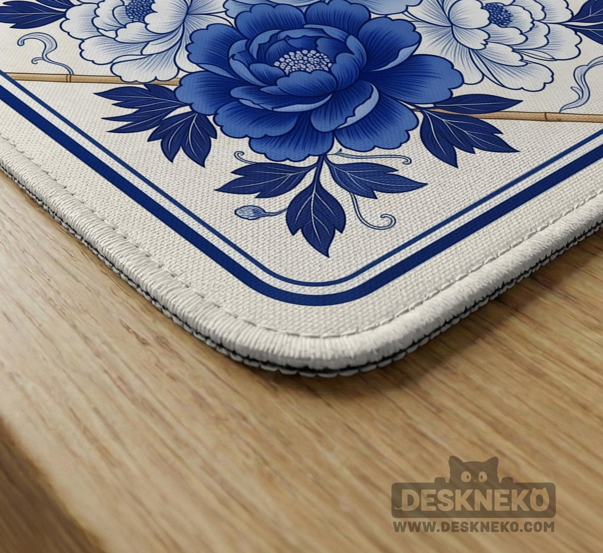 Square blue and white mahjong mat with peonies, cranes, pagoda accents, and chinoiserie linework around a plain center.
