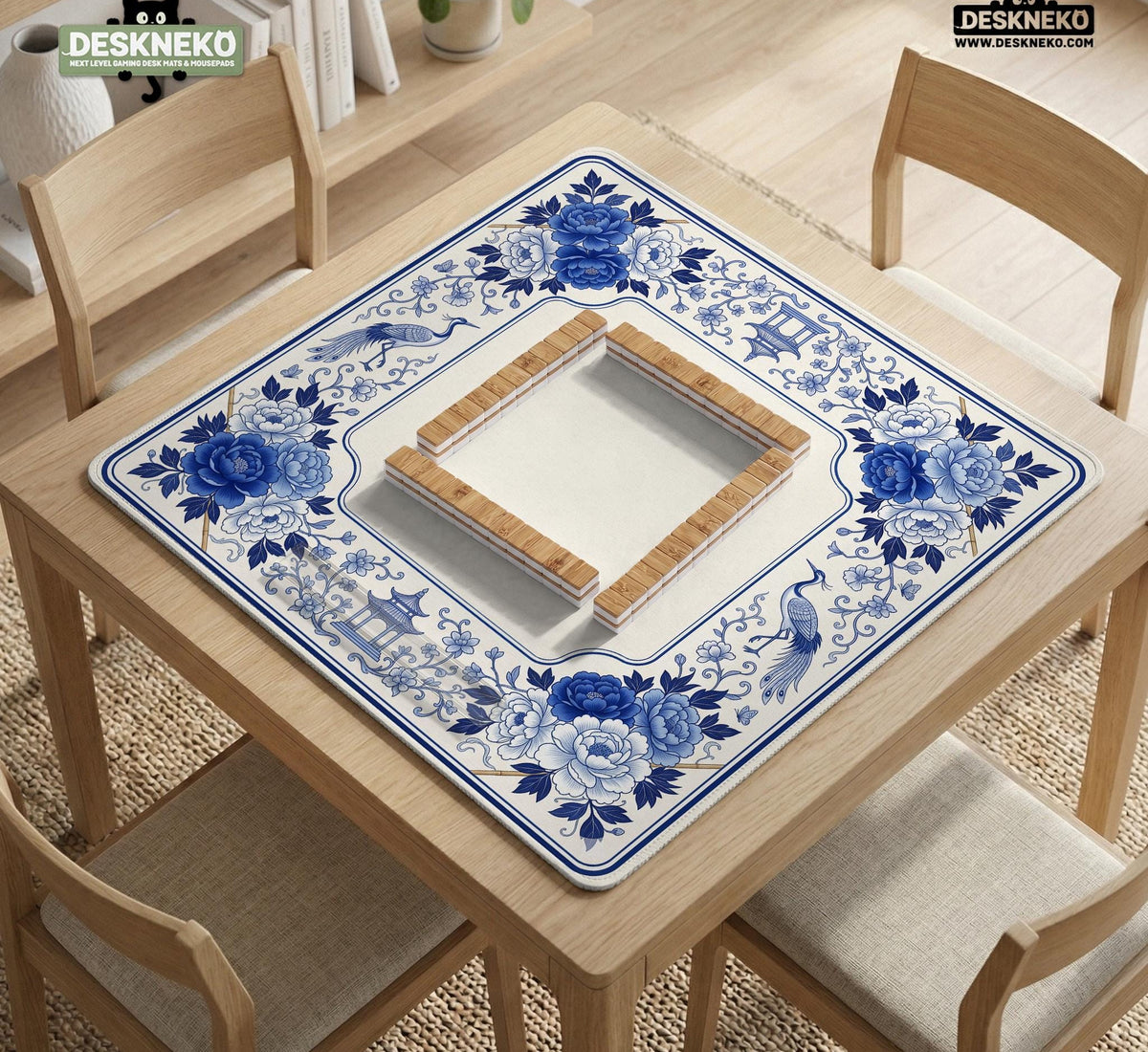 Square blue and white mahjong mat with peonies, cranes, pagoda accents, and chinoiserie linework around a plain center.